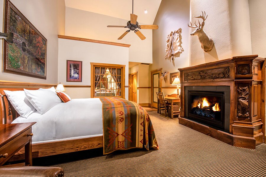 Falls Lodge king bedroom accommodation with fireplace at Big Cedar