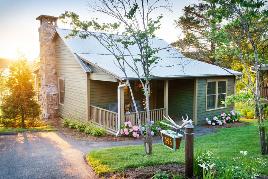 Bass Pro Shops Lakeside Two-Bedroom Family Cottage number 595 with full kitchen and living area, fireplace and view of Table Rock Lake at Big Cedar
