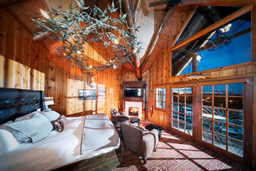 Spring View Premier King bedroom with fire place and balcony view of Table Rock Lake at Big Cedar