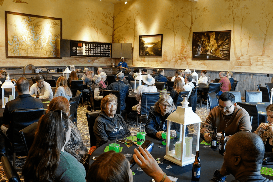 Adults enjoying bingo night with beverages