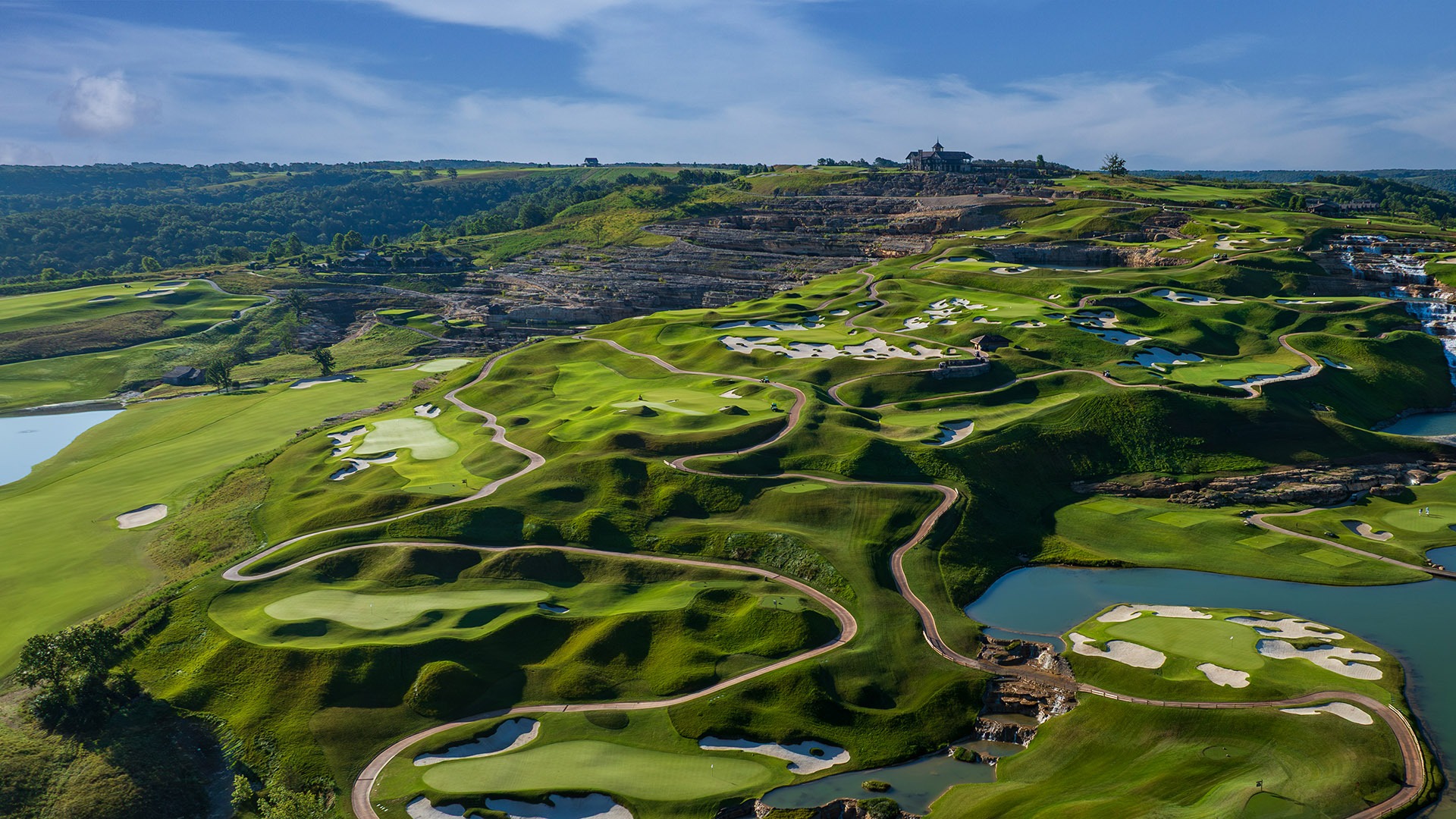 cliffhangers golf course completed showcasing the giant slopes and clubhouse in the distance