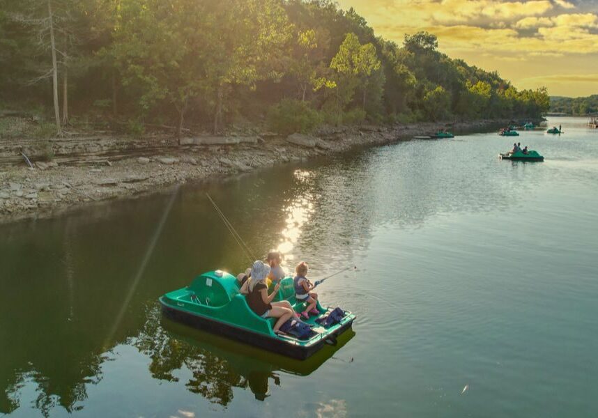 A family enjoys Table Rock Lake and competes in the Paddleboat Family Fishing Tournament