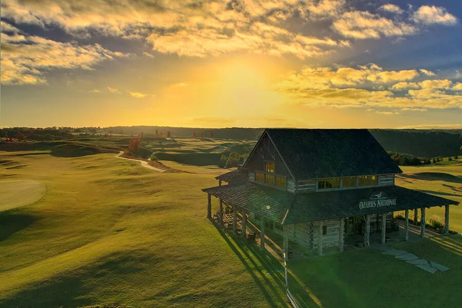 ozarks national clubhouse sits in the warm glow of a golden sunrise