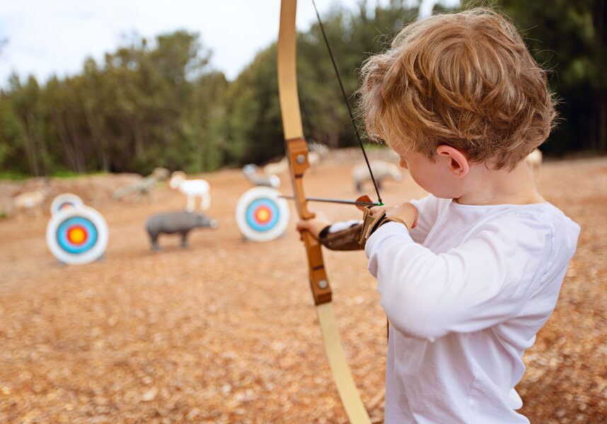 Turkey Shootout - Child Practicing Archery with Safety Equipment