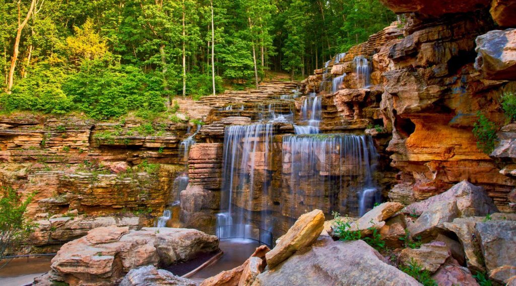 Waterfall down rock formations on the Lost Canyon Cave Nature Trail at Top of the Rock at Big Cedar