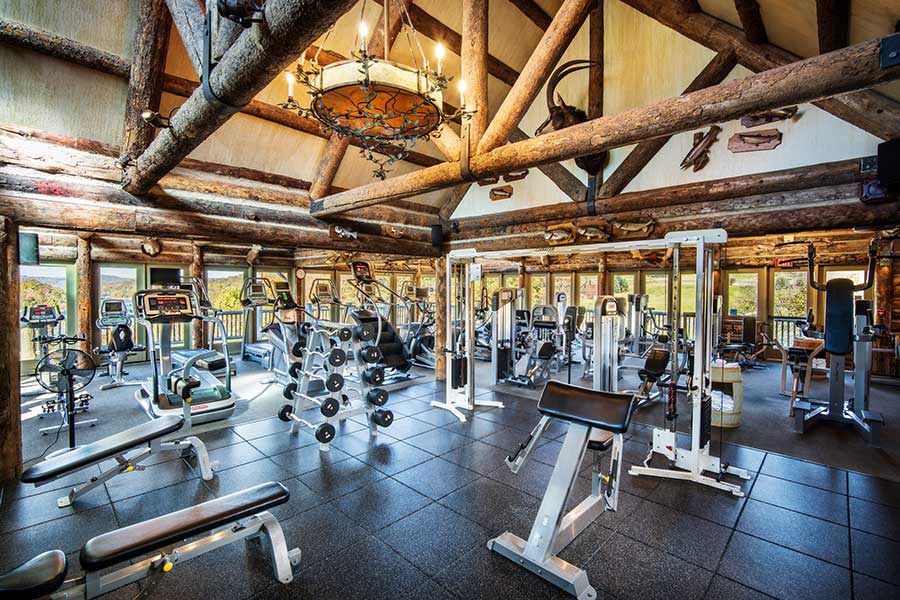 gym equipment sprawled out inside a lodge
