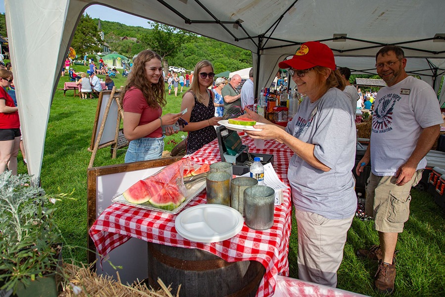 big cedar lodge employee plates watermelon for guest on memorial day