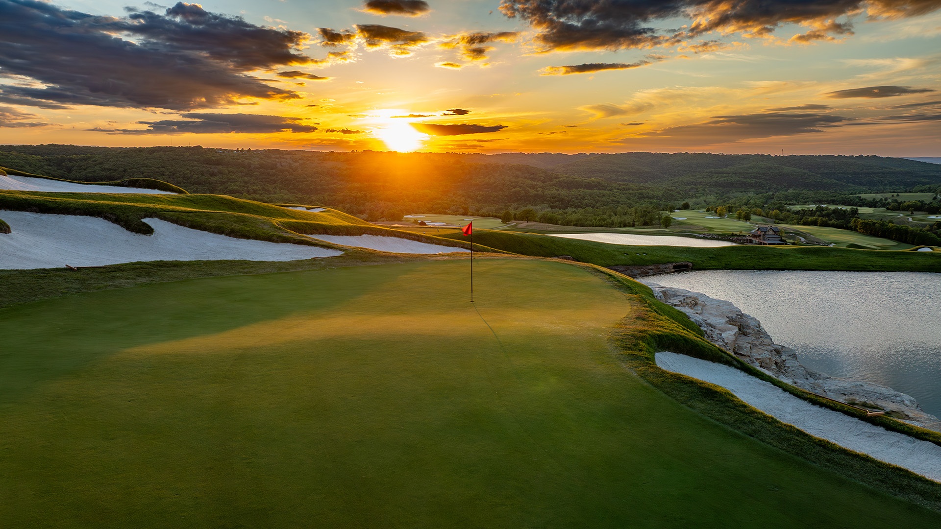 cliffhangers at big cedar nature golf with the sun rising over a flagstick