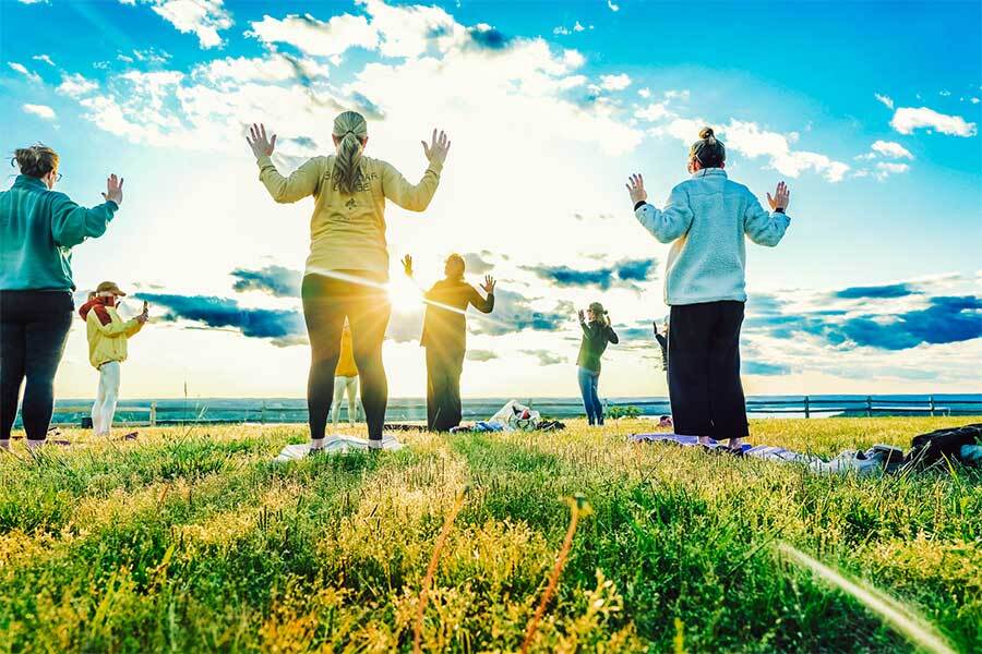 Guests participating in a yoga class overlooking Table Rock Lake