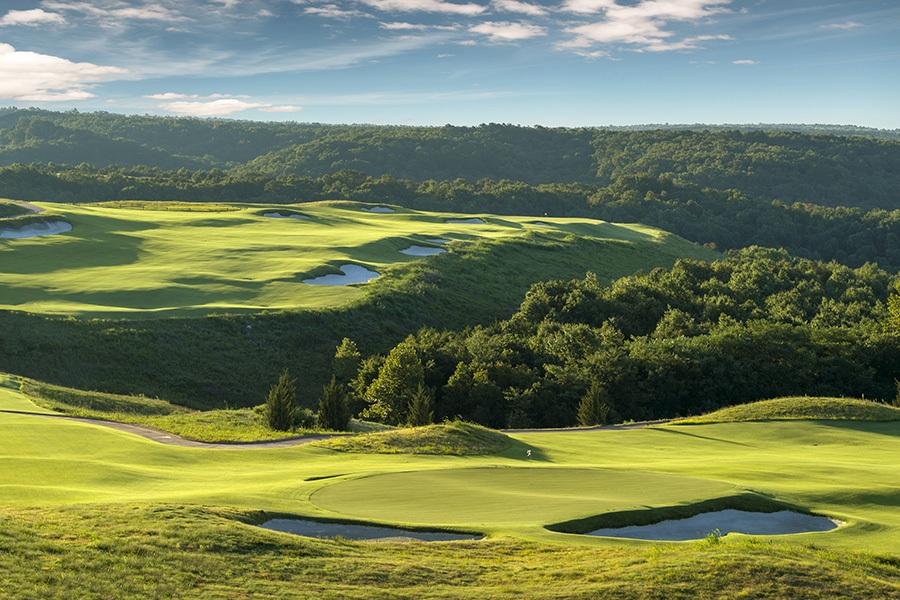 ozarkian hills create waves in the forest and fairways of ozarks national golf course