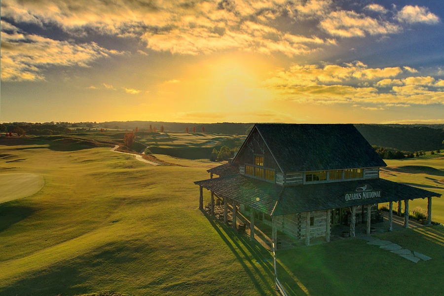 ozarks national clubhouse sits in the warm glow of a golden sunrise