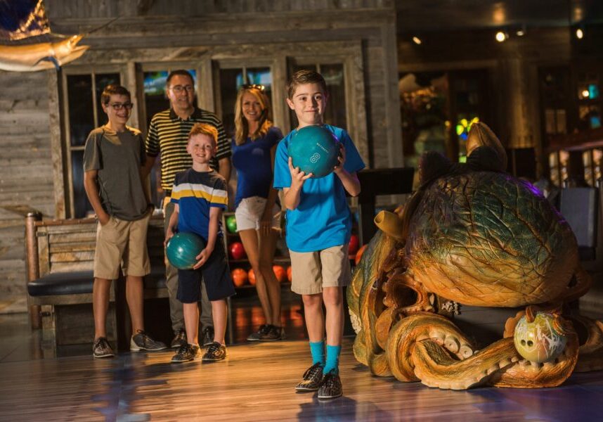 Family bowling at Fun Mountain's underwater bowling lanes.