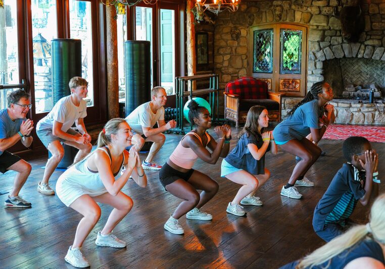 People squatting in work out clothes