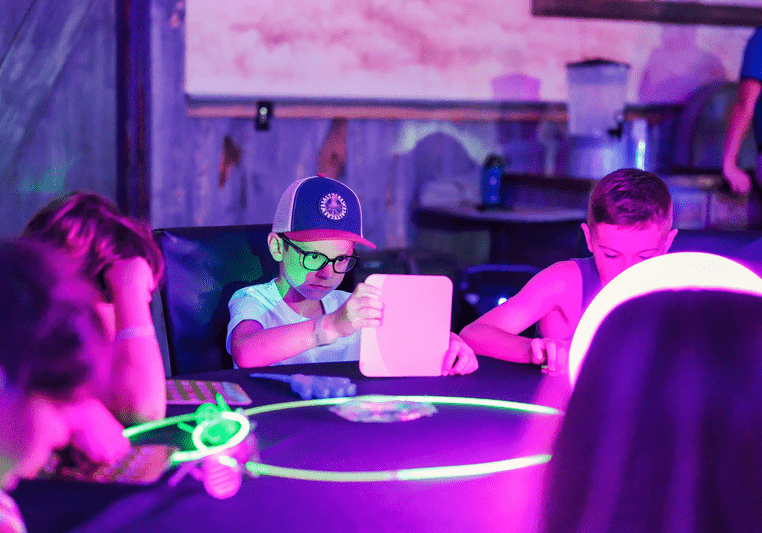 children carefully marking bingo cards