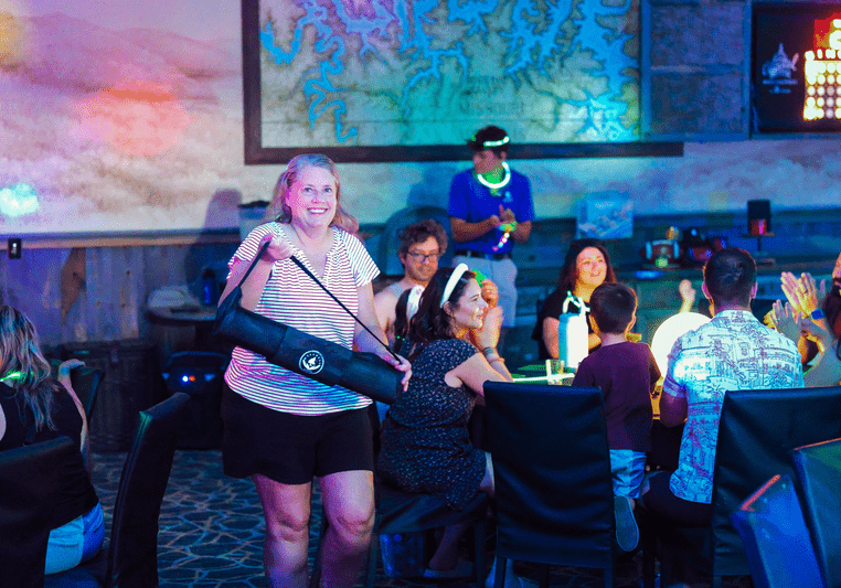 woman wins prize at black light bingo