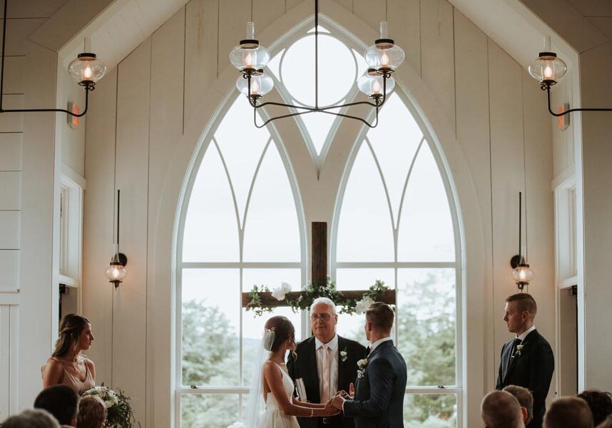 Couple exchanging wedding vows at the Garden Chapel at Big Cedar