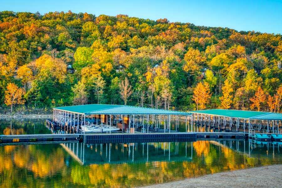 Bent Hook Marina at Big Cedar boat docks against a hillside of fall trees