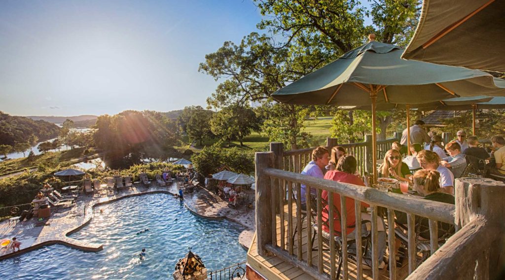 Devil's Pool dining at Big Cedar outdoor patio overlooking swimming pool and lake