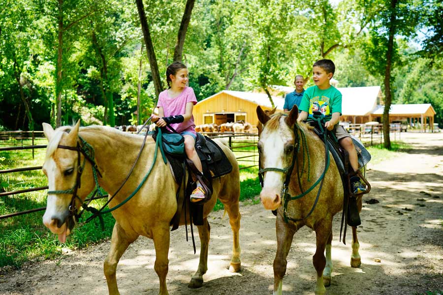 Kids horseback riding at Dogwood Canyon Nature Park at Big Cedar