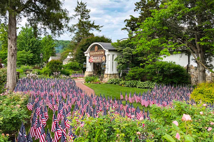 The lawn outside of the Big Cedar Lodge registration building is covered in small United States flags for a Memorial Day celebration