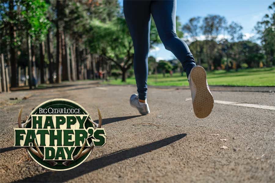 Person's legs as she is running a 5k with Father's Day logo