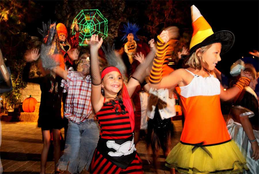 Kids Dancing at an Outdoor Halloween Party