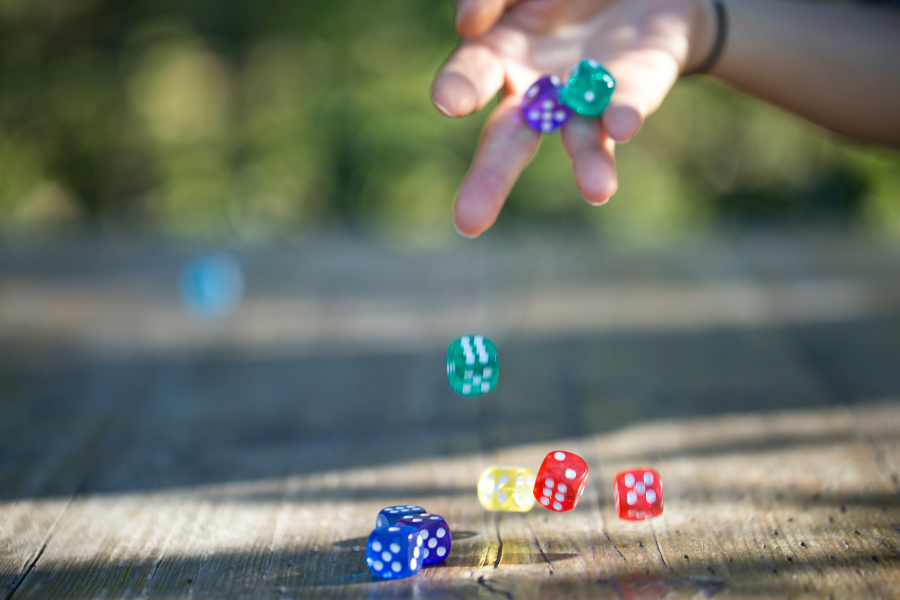 Playing bunco with colorful dice in natural light