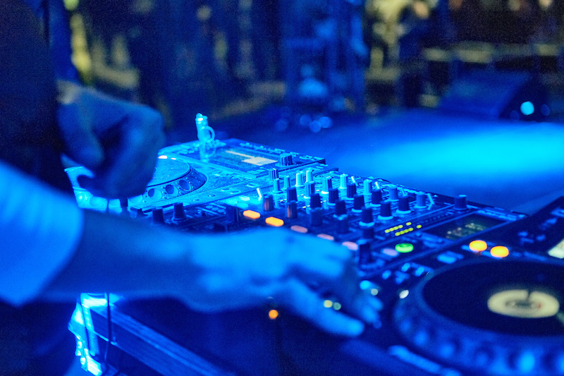 Image of DJ Spinning Music at Party