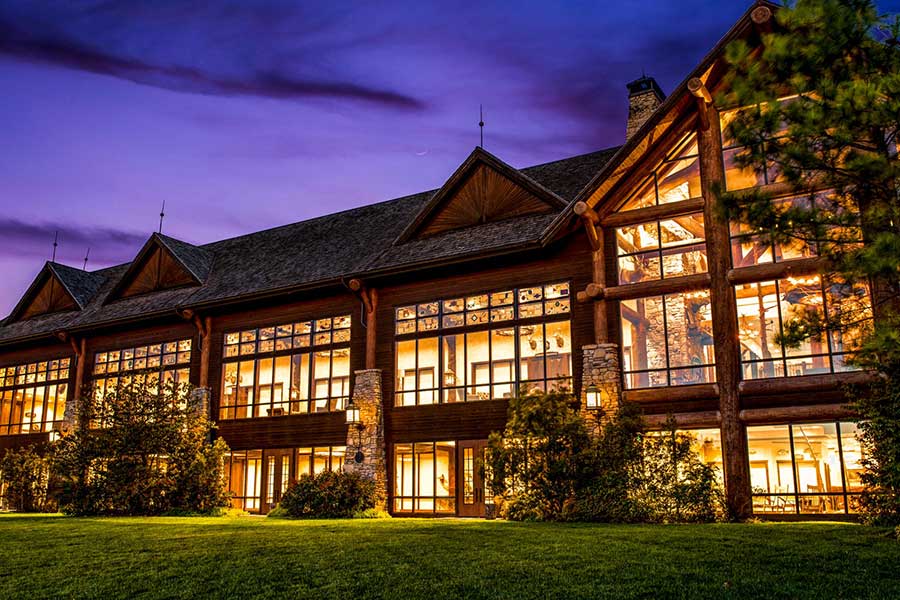 Grandview Conference Center night view exterior as it sheds light on large outdoor lawn space at Big Cedar.