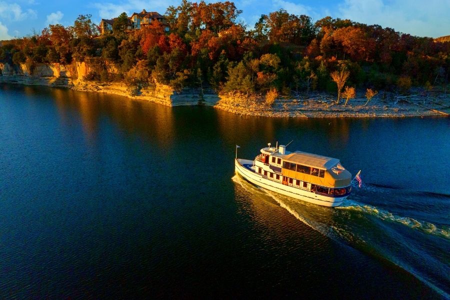 The Lady Liberty sails in the Table Rock Lake with pristine views of the Ozark foliage.