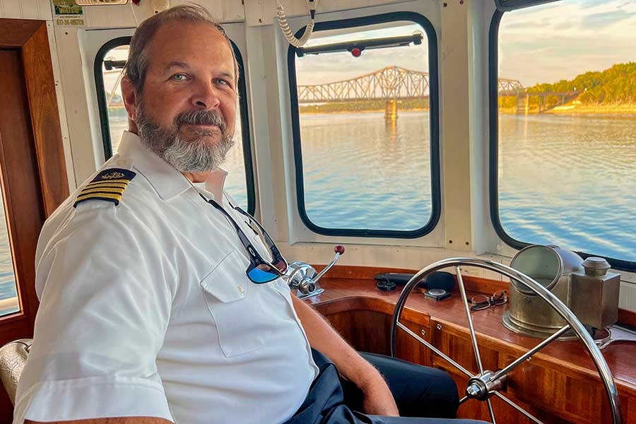 Captain Zek at the helm of Big Cedar's Lady Liberty Yacht