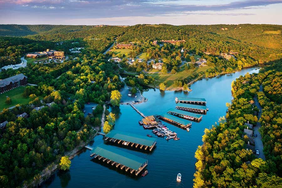 Bent Hook Marina with Big Cedar Lodge and the rolling hills behind as seen from an aerial view
