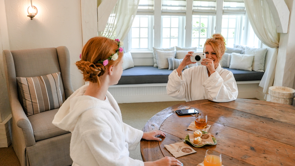 A mom takes a photo of her daughter during the Royal Treatment at Cedar Creek Spa.