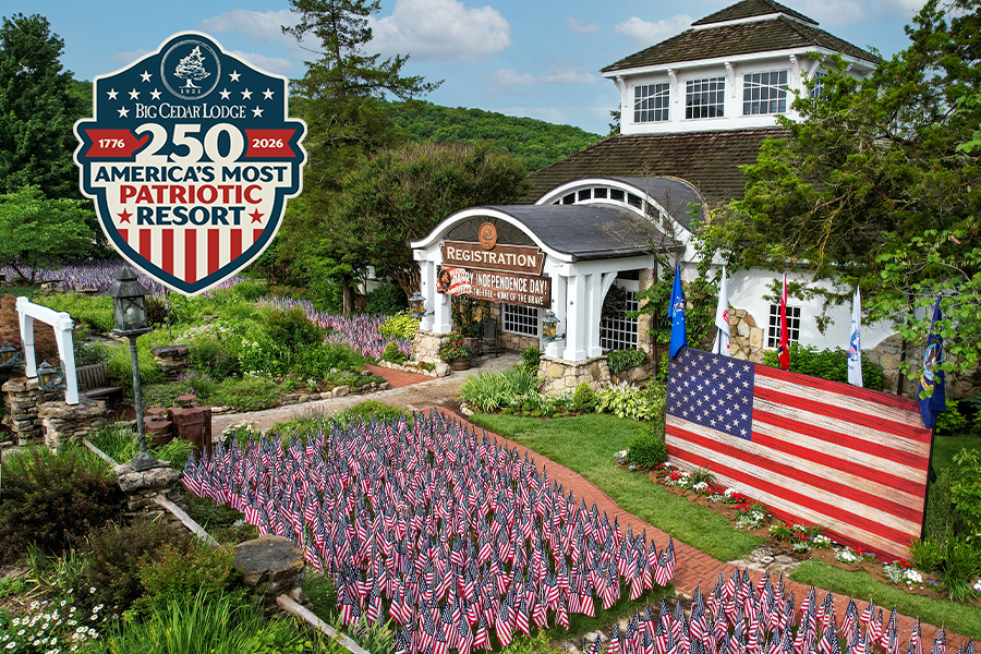 the Big cedar Lodge registration building; ding lawn filled with miniature American flag's stuck in the ground for America's 250th anniversary