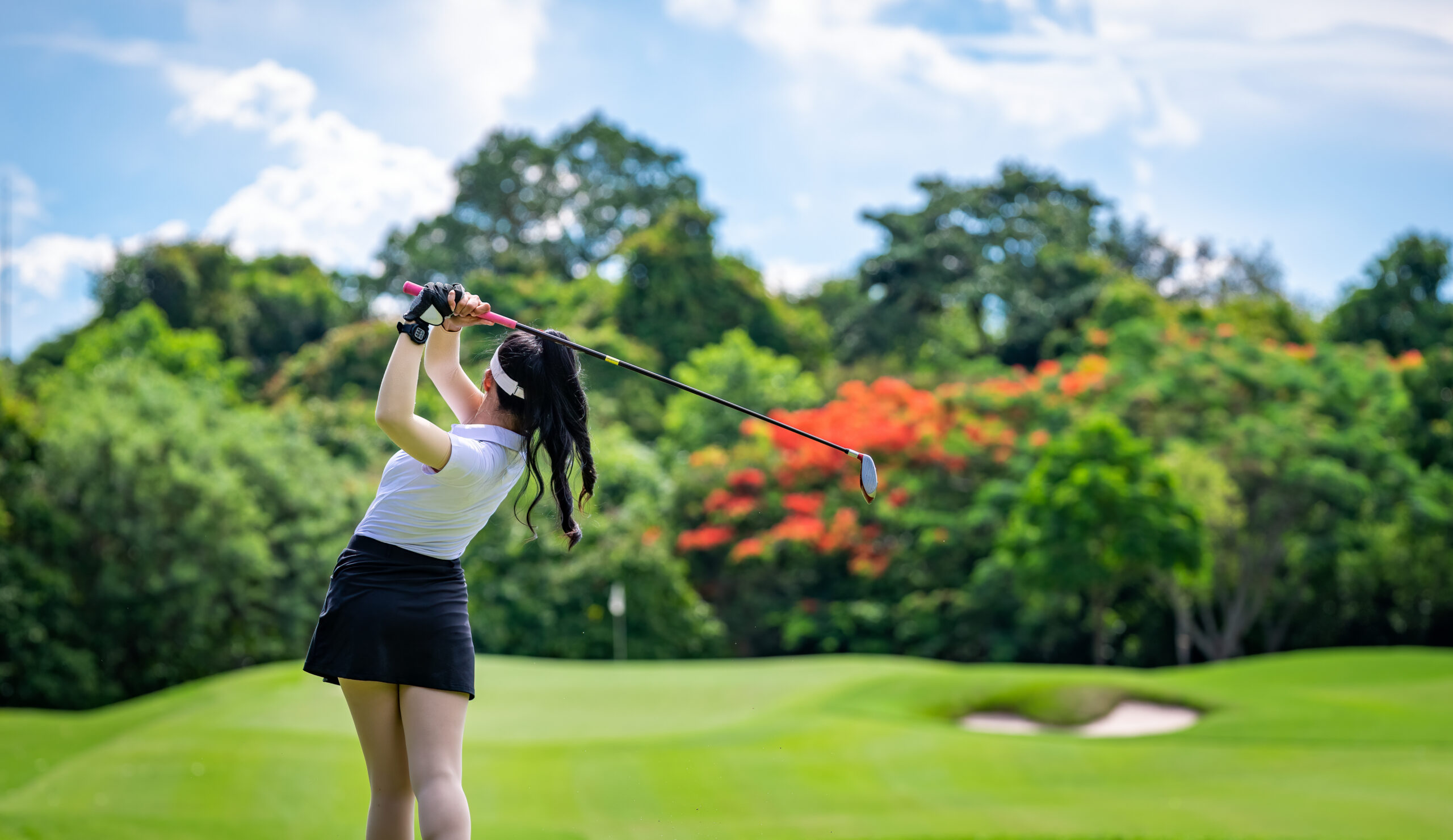 Woman playing golf