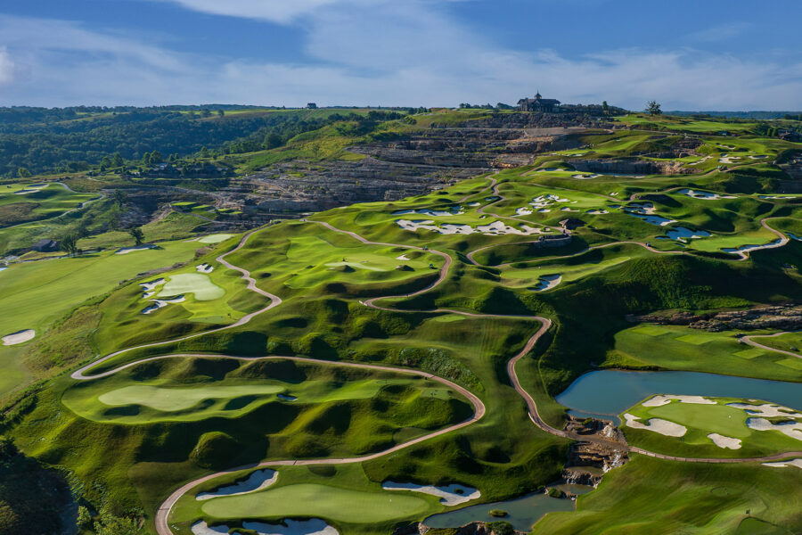 cliffhangers golf course completed showcasing the giant slopes and clubhouse in the distance