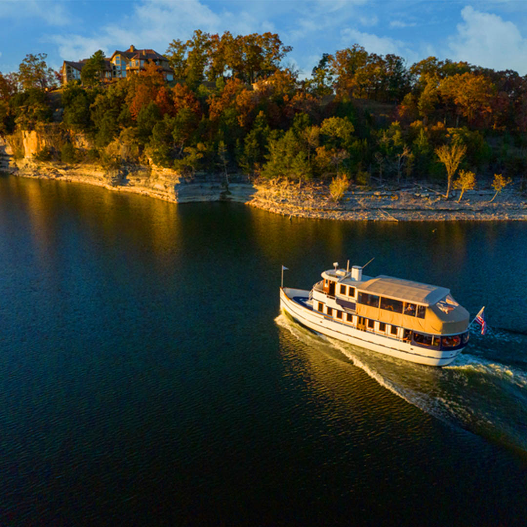 Lady LIberty Fall Foliage Cruise_square lady liberty cruising on table rock lake next to a coastline with trees in the fall