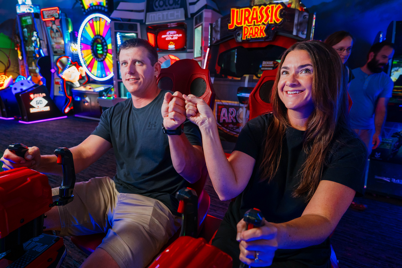 Couple playing arcade game
