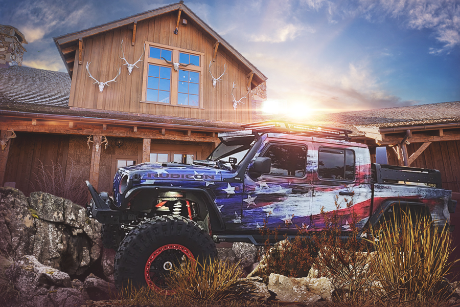 a jeep rubicon with an American flag paint job at sunset in front of thunder ridge nature arena