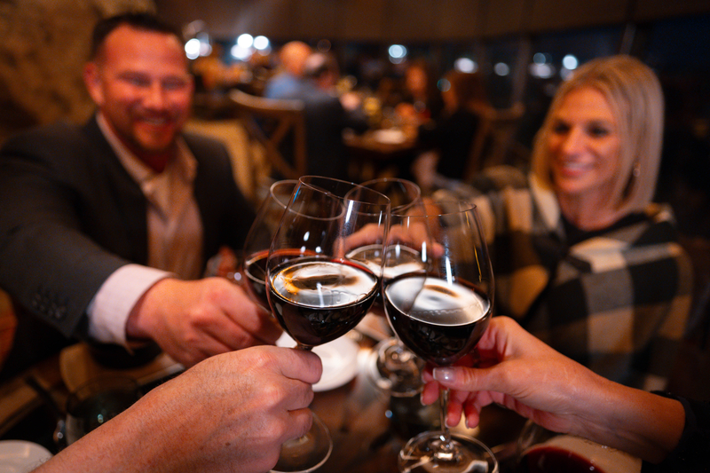 Clinking wine glasses at the Pour & Gourmet tour