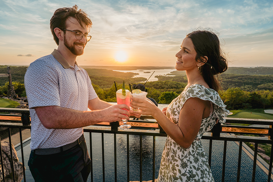 A couple drinking cocktails at Big Cedar Lodge Osage at Top of the Rock