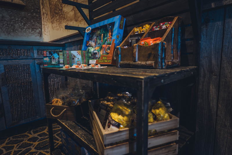 A shelf with toys, activity kits, and snacks for purchase in the Activity Center