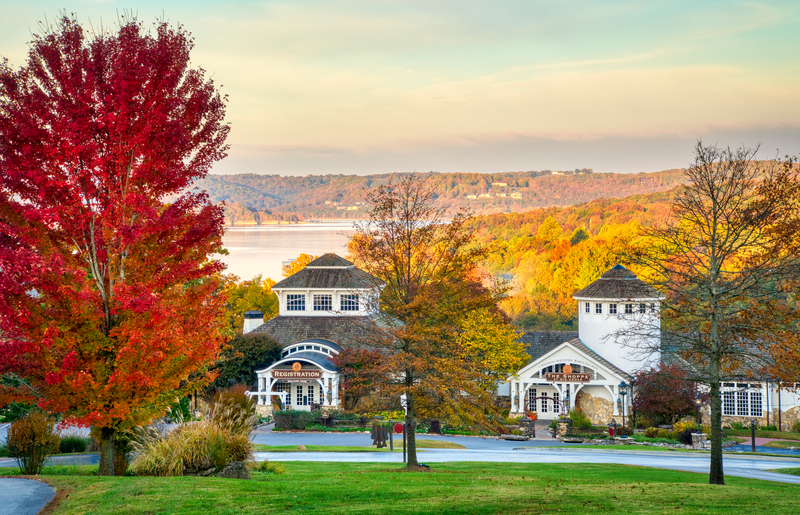 The registration building at Big Cedar Lodge in the fall Table Rock Lake covered in mist in the background
