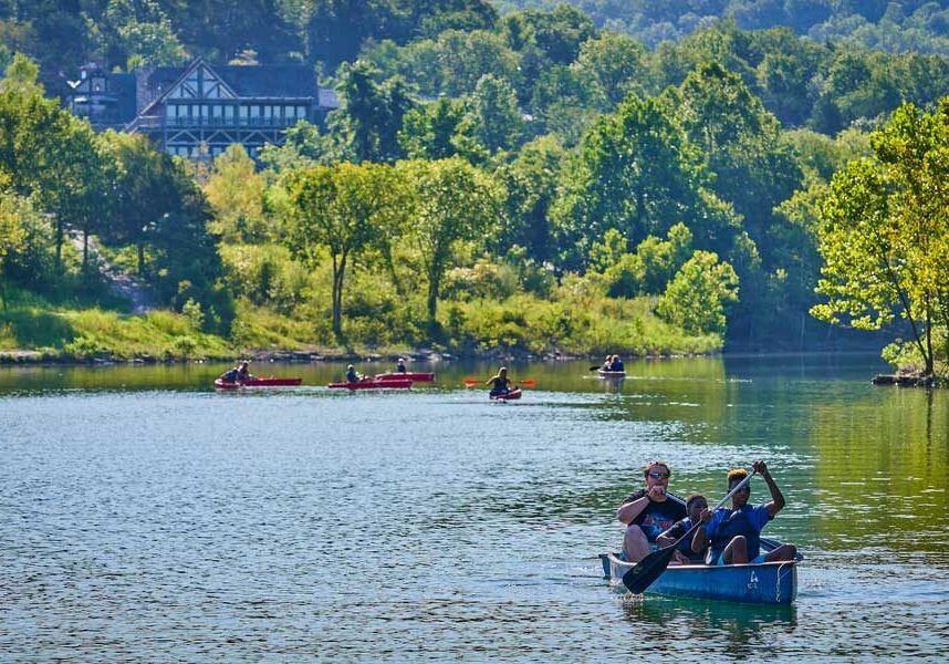 people canoeing in a cove