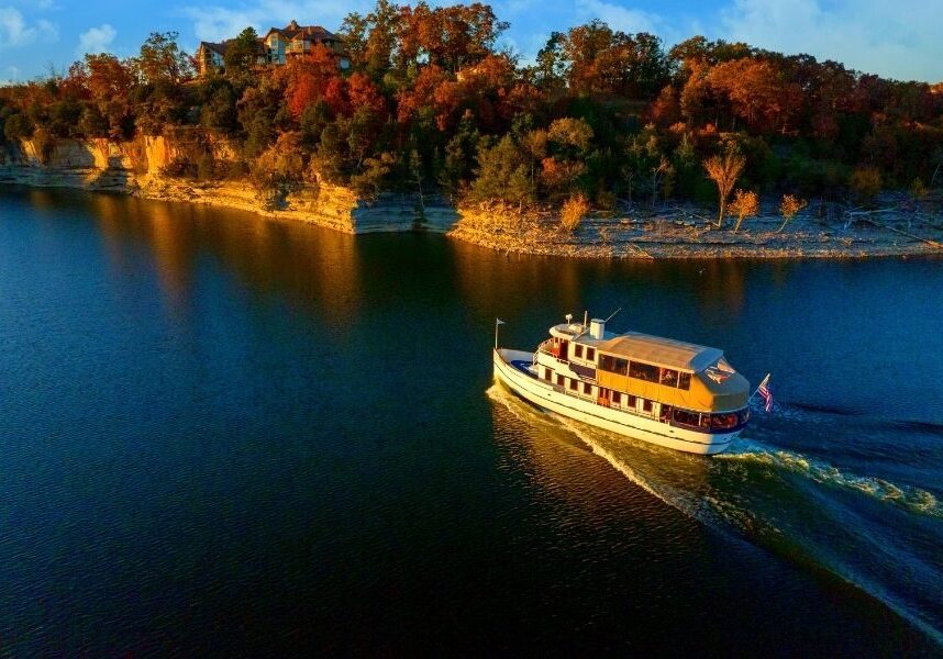 The Lady Liberty sails in the Table Rock Lake with pristine views of the Ozark foliage.