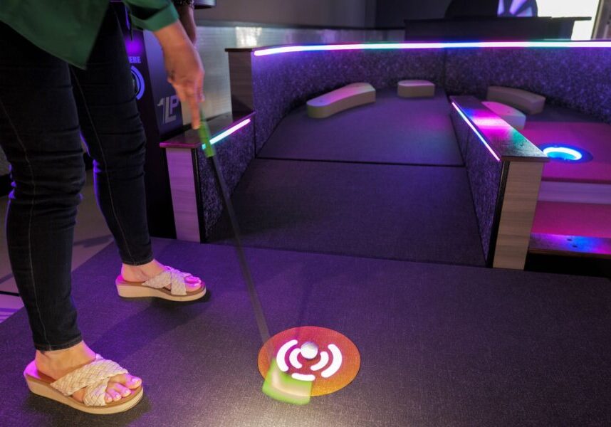 guest plays a round at lucky putt