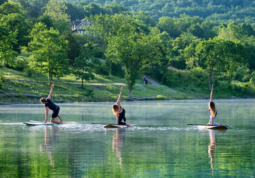 People enjoy yoga flows on stand up paddleboards on Table Rock Lake.