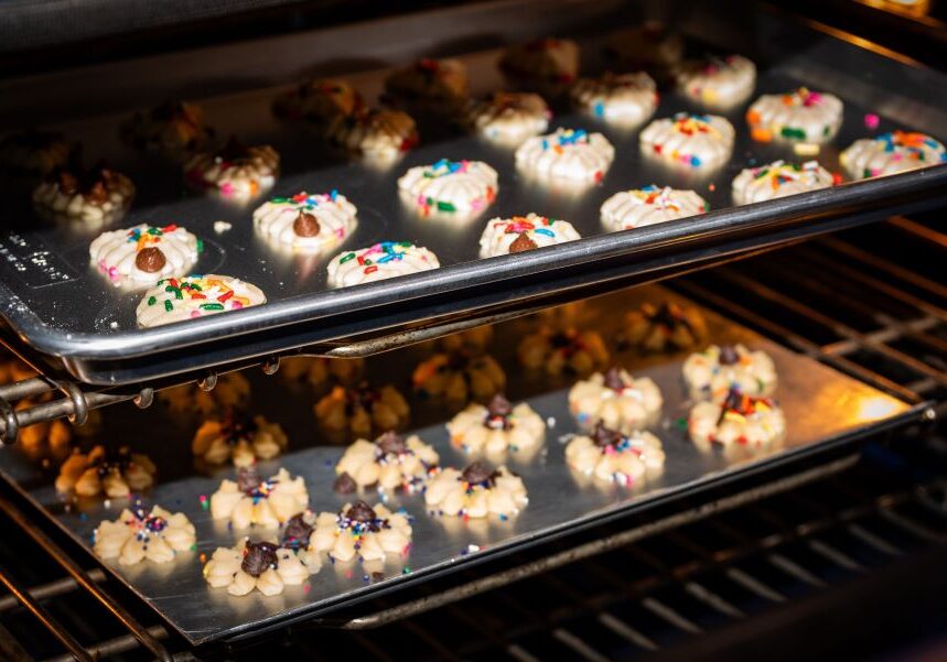 Sugar cookies with sprinkles baking in the oven