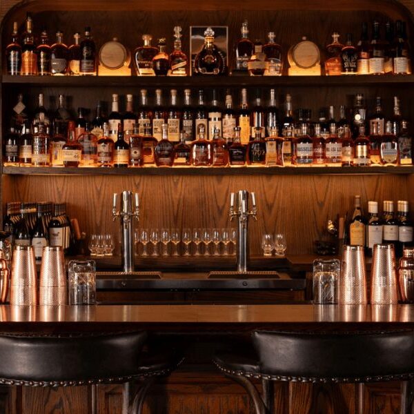 The Harry's Cocktail Lounge Bar sits clean and stocked with high quality bourbon whiskey.