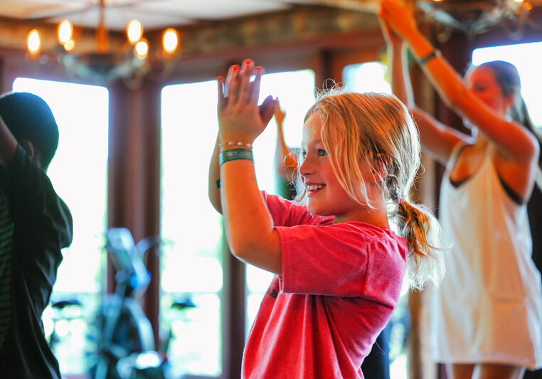 People clapping and spiling in work out clothes